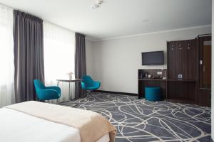 Televízia a/alebo spoločenská miestnosť v ubytovaní Hotel Nad Nettą