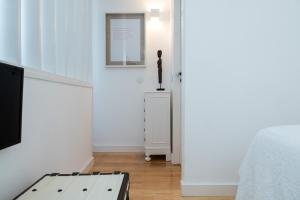 Cama ou camas em um quarto em Lugares Com História
