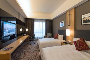 Postel nebo postele na pokoji v ubytování Impiana Hotel Senai