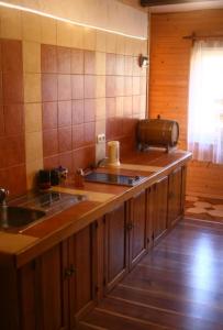 a kitchen with a counter with a sink and aounter at Friendly House in Kolomyya