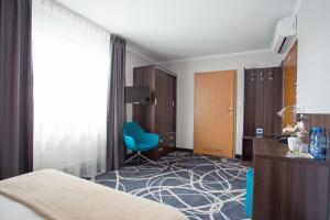 Posteľ alebo postele v izbe v ubytovaní Hotel Nad Nettą
