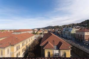a view of a town with buildings and a street at Mansarda in Borgo Po in Turin