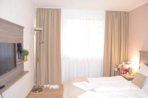 Posteľ alebo postele v izbe v ubytovaní Resort Erich
