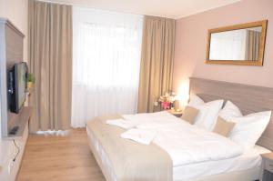 Posteľ alebo postele v izbe v ubytovaní Resort Erich