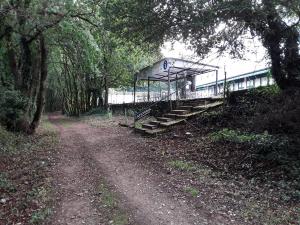 a train station with stairs next to a dirt road at Hotel Castro in Santiago de Compostela