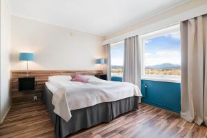 Postel nebo postele na pokoji v ubytování Bardufoss Hotell + 37 fotografií