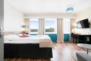 Postel nebo postele na pokoji v ubytování Bardufoss Hotell