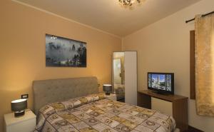 Posteľ alebo postele v izbe v ubytovaní Hotel Il Giardino