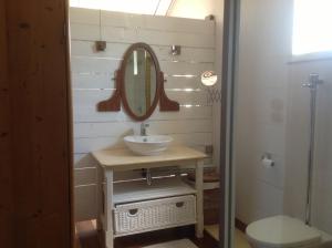 a bathroom with a sink and a mirror at La grange de G. in Grand Gaube +27 photos