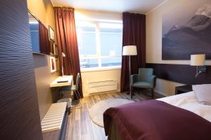 Postel nebo postele na pokoji v ubytování Bardufoss Hotell