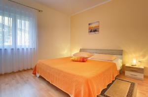 Postel nebo postele na pokoji v ubytování Apartments Danilo