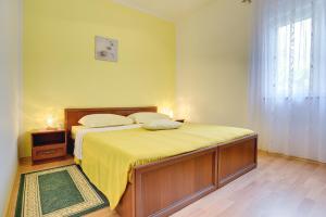 Postel nebo postele na pokoji v ubytování Apartments Danilo