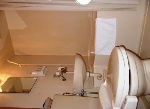 
a bathroom with a white sink and a white toilet at Hakodate Motomachi Hotel in Hakodate
