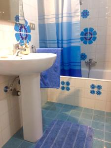 a bathroom with a sink and a shower at Casa Del Parco in Polignano a Mare