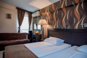 Säng eller sängar i ett rum på Hotel Crnogorska Kuća