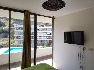 Et tv og/eller underholdning på Departamento en Reñaca 2D-2B edificio Reñaca Park II