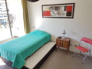 En eller flere senge i et værelse på Departamento en Reñaca 2D-2B edificio Reñaca Park II + 12 billeder