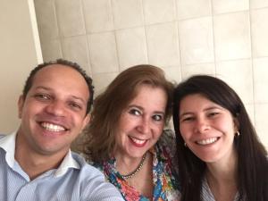 a man and two women posing for a picture at Pousada Family Consulado Americano in São Paulo