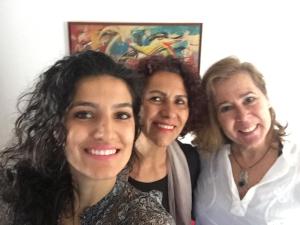 three women are posing for a picture together at Pousada Family Consulado Americano in São Paulo