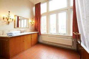a bathroom with a sink and a large window at Superior, 100m2 in Amsterdam