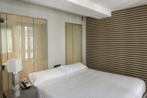 Postel nebo postele na pokoji v ubytování Hotel Atalaia