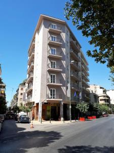a large apartment building on the side of a street at Athens Comfort in Athens