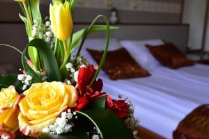 Ένα ή περισσότερα κρεβάτια σε δωμάτιο στο Garni Hotel Lav