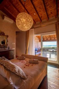 A bed or beds in a room at Quercia Belvedere Relais