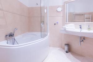 Phòng tắm tại Unitas Hotel