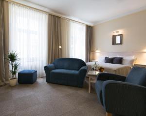 Khu vực ghế ngồi tại Unitas Hotel