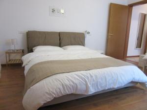 A bed or beds in a room at Portico88