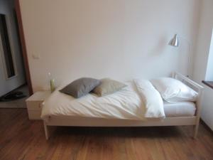 A bed or beds in a room at Portico88