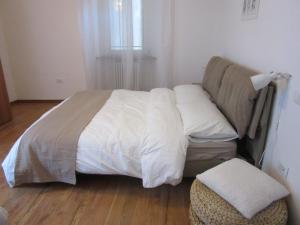 A bed or beds in a room at Portico88