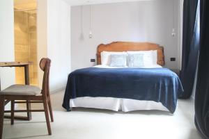 Cama ou camas em um quarto em Hotel Florinda
