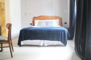 Cama ou camas em um quarto em Hotel Florinda