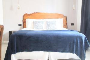 Cama ou camas em um quarto em Hotel Florinda