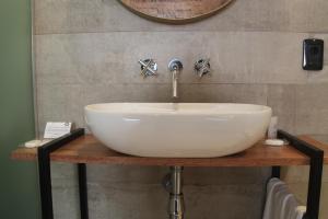 Um banheiro em Hotel Florinda