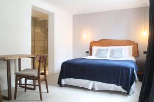 Cama ou camas em um quarto em Hotel Florinda