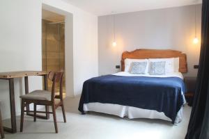 Cama ou camas em um quarto em Hotel Florinda