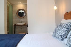 Cama ou camas em um quarto em Hotel Florinda