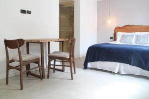 Cama ou camas em um quarto em Hotel Florinda