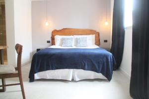 Cama ou camas em um quarto em Hotel Florinda