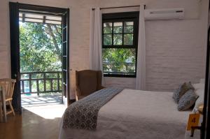 Ein Bett oder Betten in einem Zimmer der Unterkunft Santoral Restaurante y Posada Pet Friendly