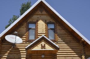 a log cabin with two windows and a satellite at Fairy Tale in Gabala