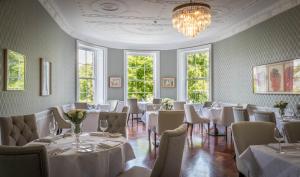 
a dining room filled with tables and chairs at Butler House in Kilkenny
