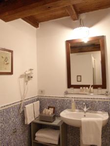 a bathroom with a sink and a mirror at Villanova - Nature & Wellness in Levanto