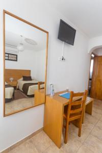 TV a/nebo společenská místnost v ubytování Apartamentos Oliveira