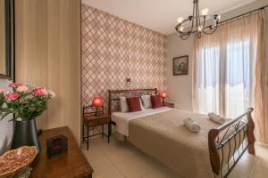 Postel nebo postele na pokoji v ubytování Villa Apollon II + 23 fotografií