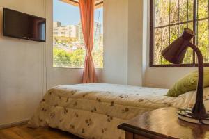 Llit o llits en una habitació de Apartamento Viña del Mar Agua Santa