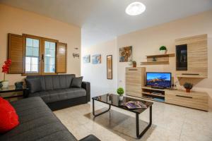 TV a/nebo společenská místnost v ubytování Victoria Penthouse